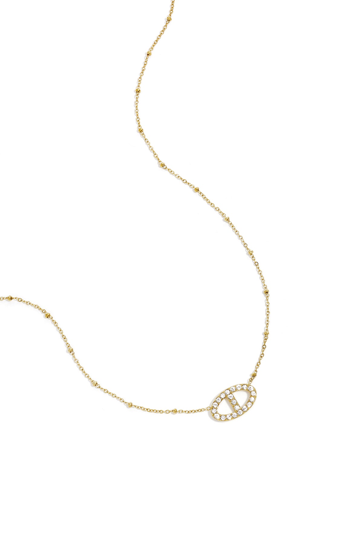 Delicate gold pendant necklace with sparkling crystal-encrusted oval pendant and beaded chain detail on white background