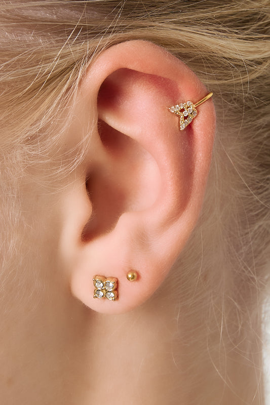 Model's ear adorned with matching gold butterfly ear cuff and earring set, displaying minimal and boutique style