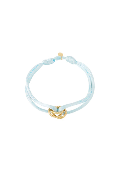 Baby blue knot charm bracelet with gold-plated twisted knot pendant on white background