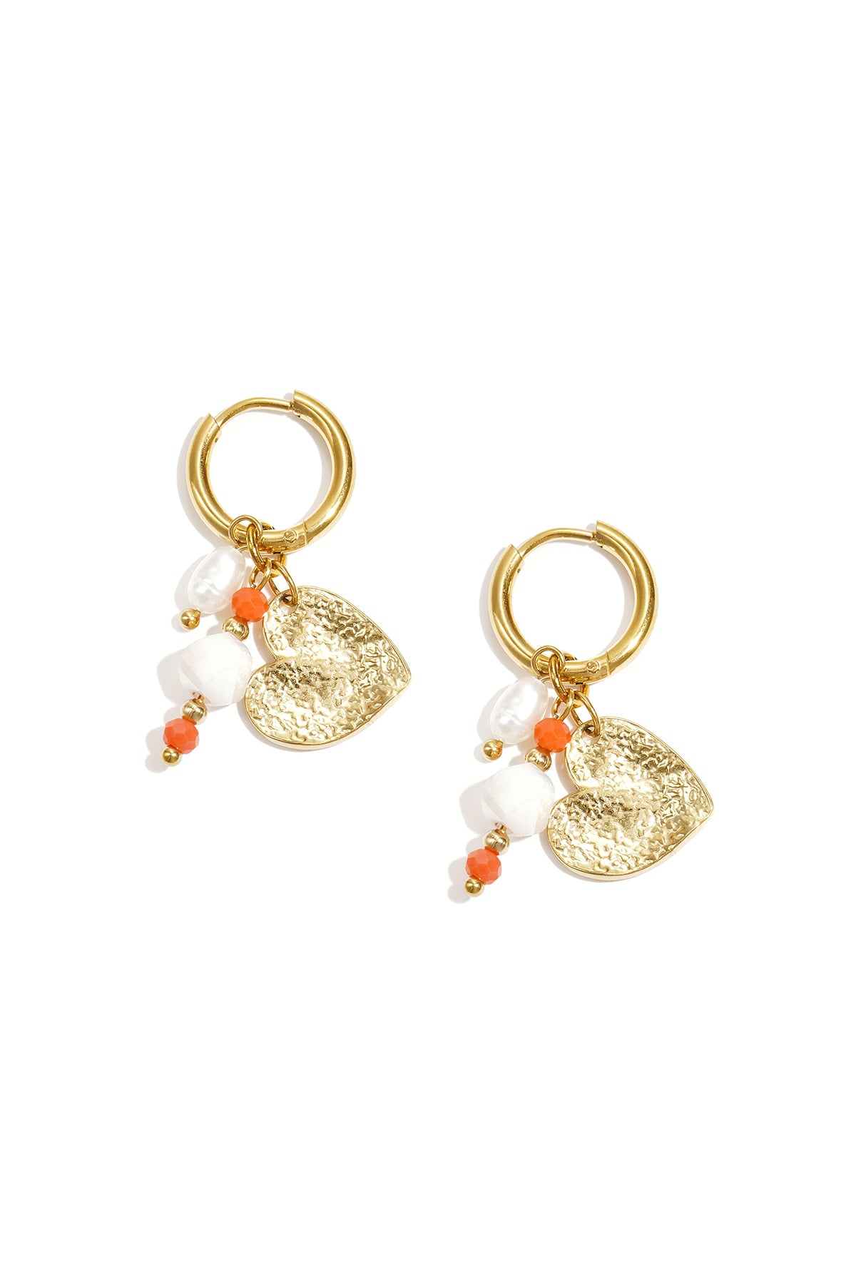 Pair of gold hoop earrings featuring hammered heart charm, pearls, and small orange and white beads on a white background