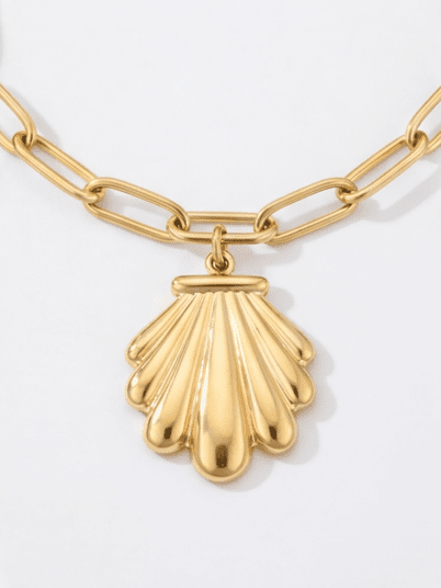 Seaside Charm Bracelet: Gold link chain with a polished, seashell-shaped pendant on a white background.