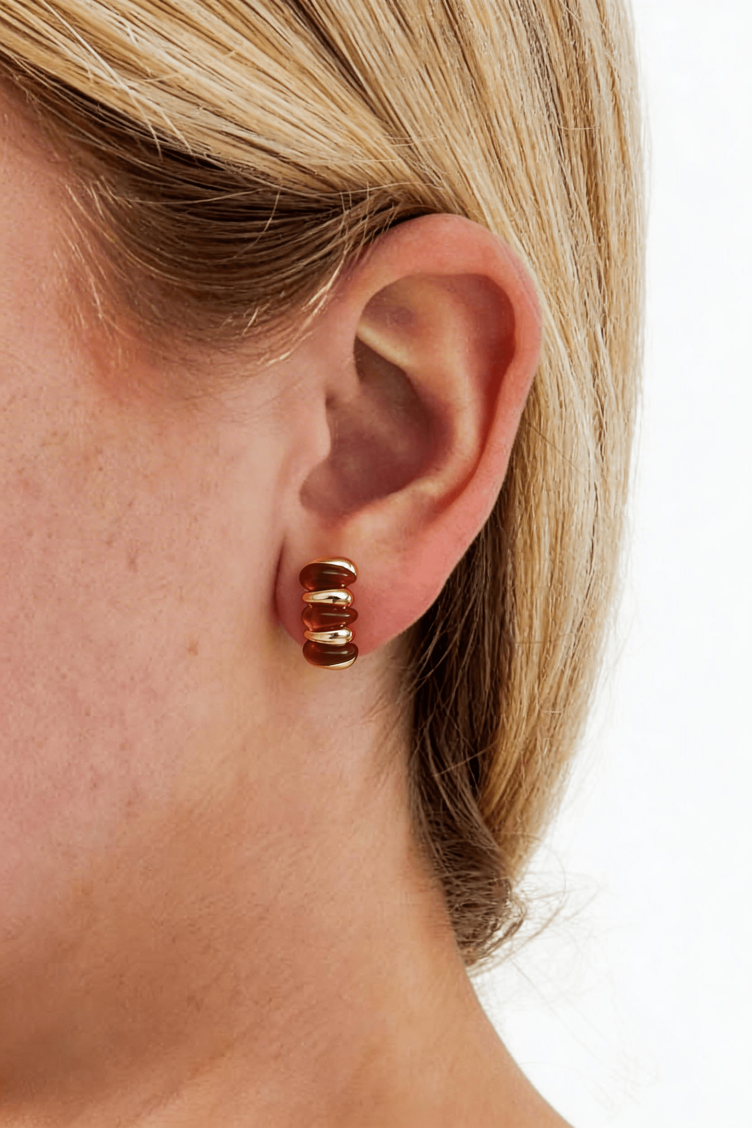 Jelly Bubble Hoops: Small, gold-plated huggie earrings featuring alternating amber-colored resin and gold ribbed beads.