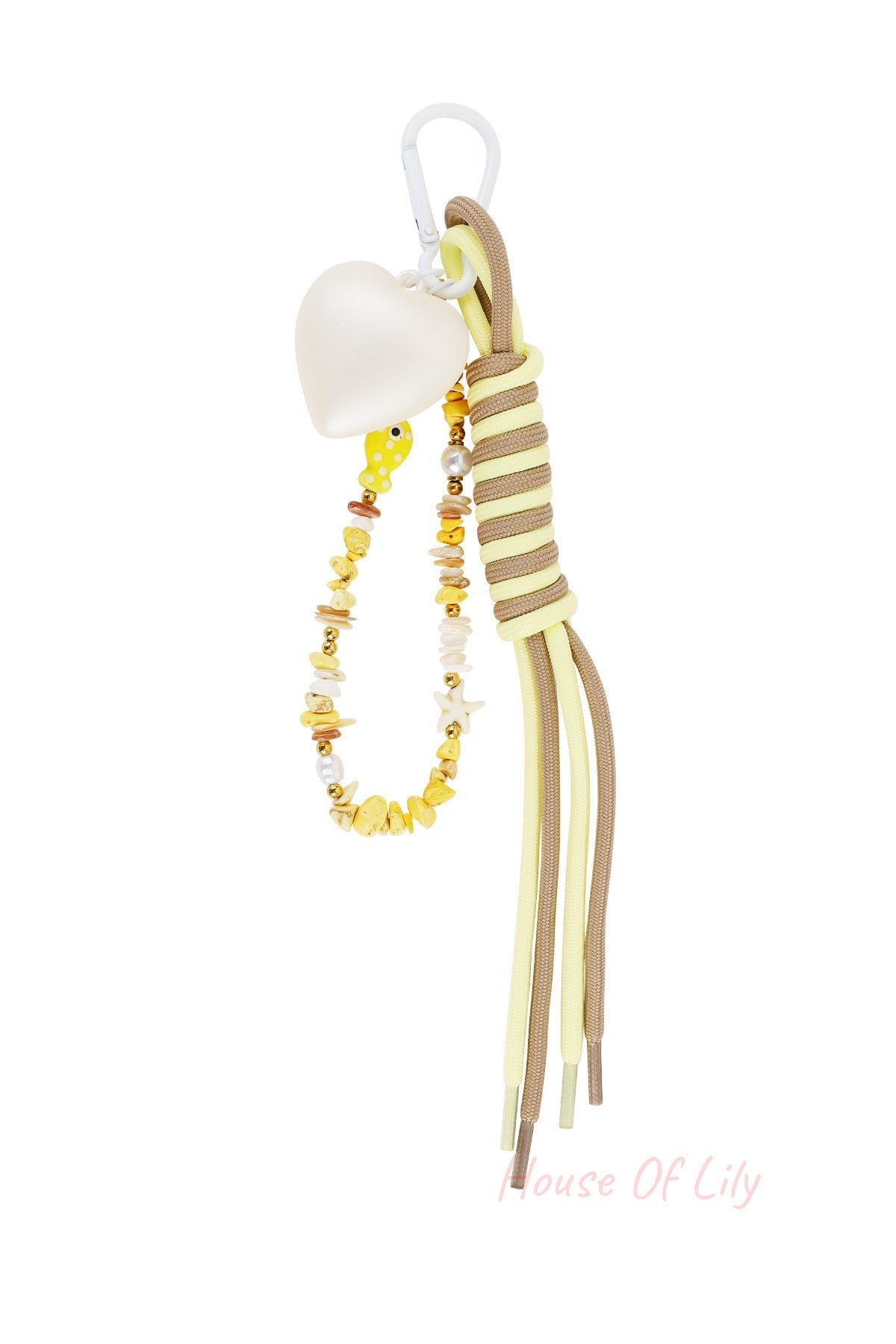 Yellow and brown heart bag charm with yellow beads and tassel on white background