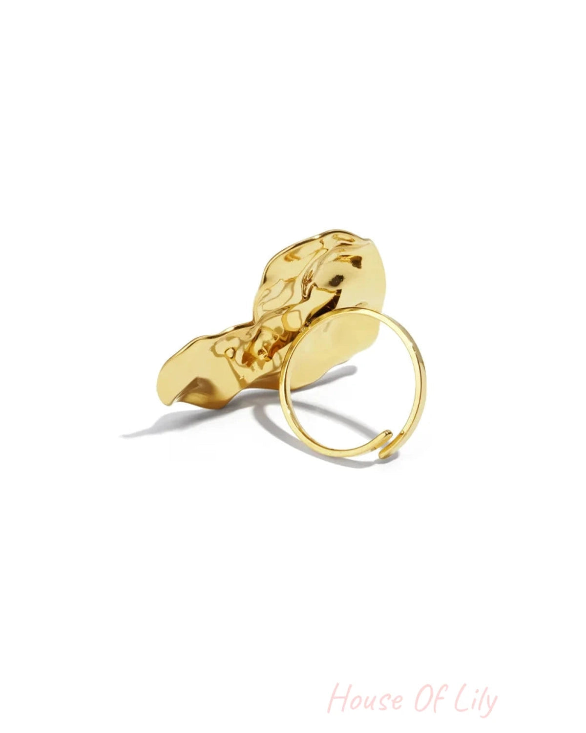 Polished gold ring with a large, abstract, and organically shaped front face.