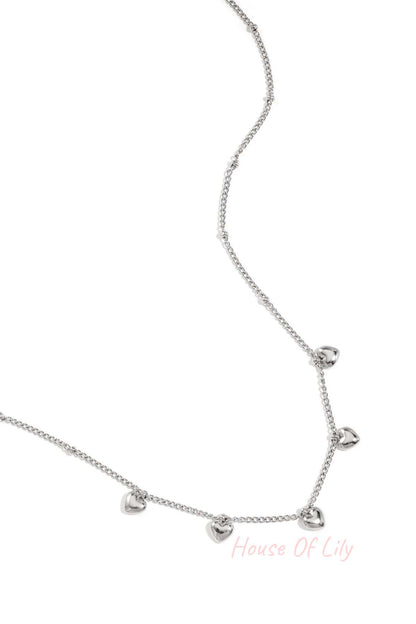 Minimalist necklace with small hearts