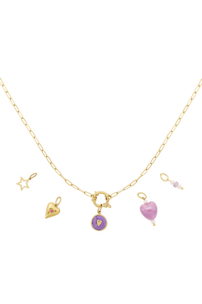 Gold-tone chain necklace with multiple interchangeable charms including purple heart, gold heart with pink gem, gold star outline, and pink beaded charm on white background