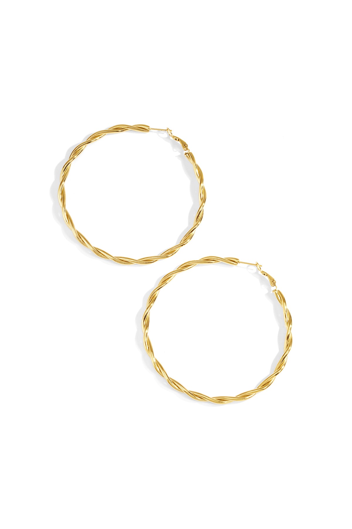 Flat lay of silver twisted oval hoop earrings with latch back closures on white background