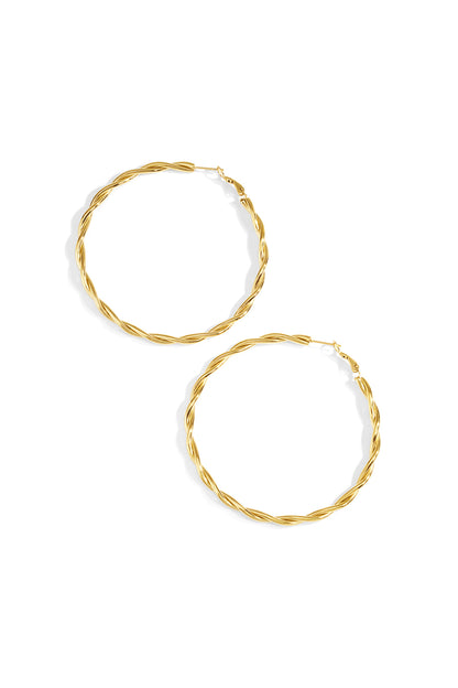 Flat lay of silver twisted oval hoop earrings with latch back closures on white background