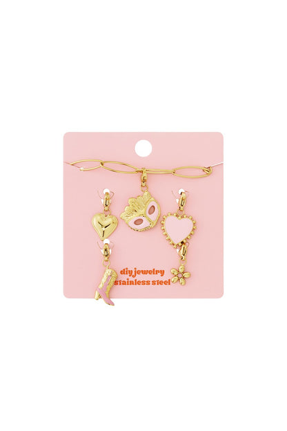 Gold stainless steel charm bracelet set with pink heart, mask, cowboy boot, and flower charms on a pink display card.