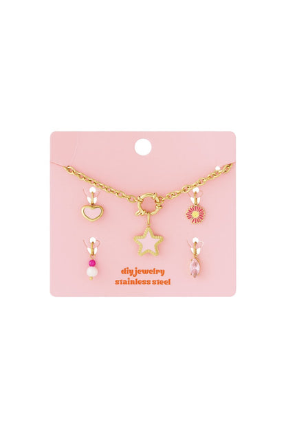 Main Character Drop gold-tone stainless steel chain necklace with removable star, heart, flower, pearl, and crystal charms.