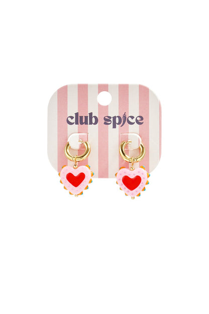 Gold hoop earrings with dangling, scalloped-edge pink heart charms featuring a bright red center on a branded card.
