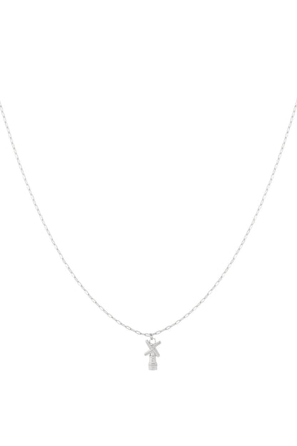 Silver chain necklace with a small windmill pendant displayed on white background