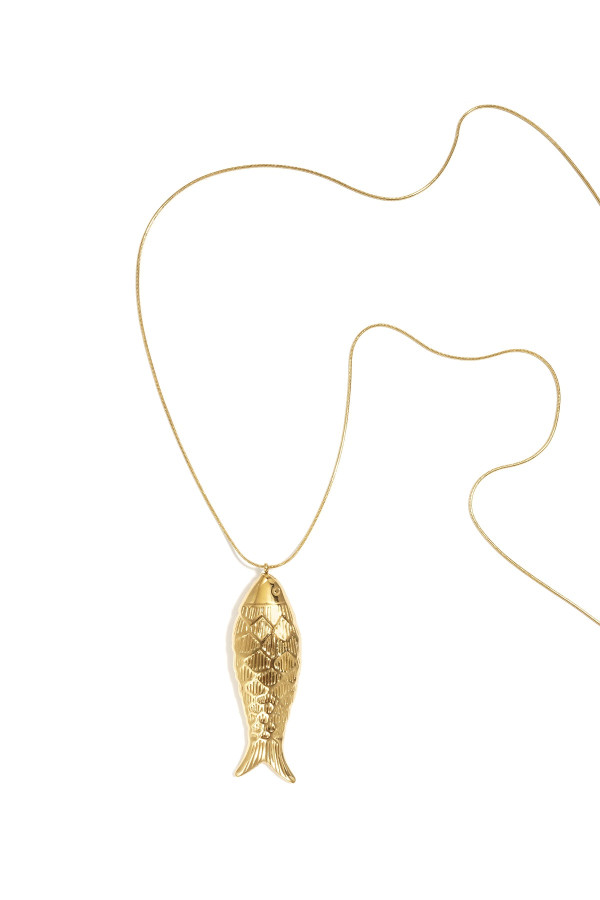 Gold long necklace with textured fish-shaped pendant on white background