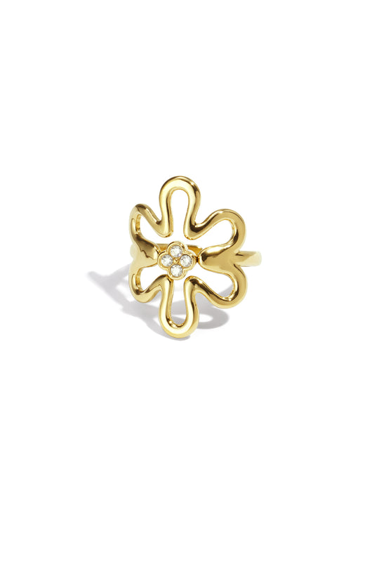 Gold tone playful flower statement ring with rhinestone cluster center on white background