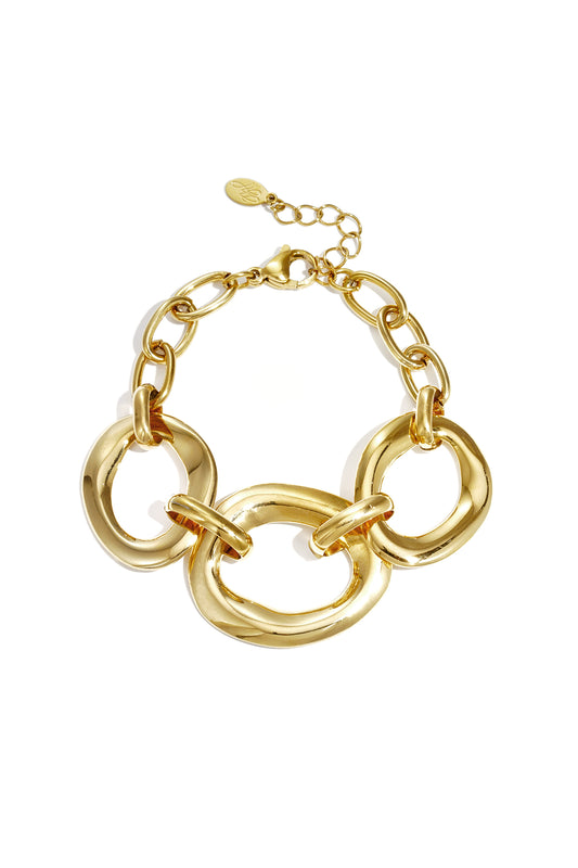 Gold chunky link bracelet with three large irregular oval links and lobster clasp on white background