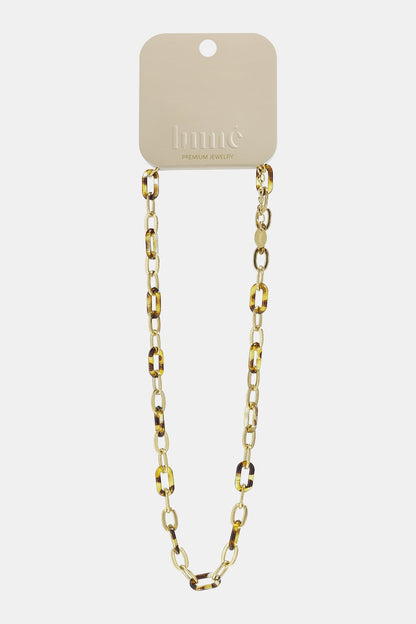 Tortoise Shell Core necklace: a gold-tone link chain interspersed with brown and gold tortoise shell pattern links.
