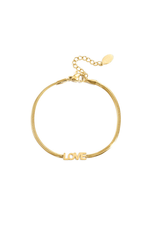 Gold-tone bracelet with a sleek snake chain and a central 'LOVE' charm, featuring an adjustable lobster clasp and extender chain on a plain white background