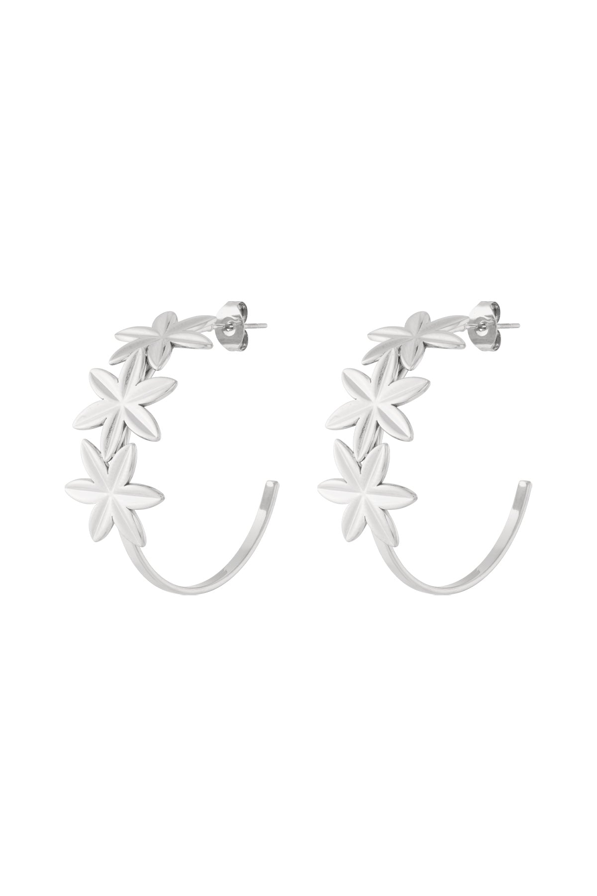 Pair of silver floral hoop earrings with three flowers on each hoop shown on white background
