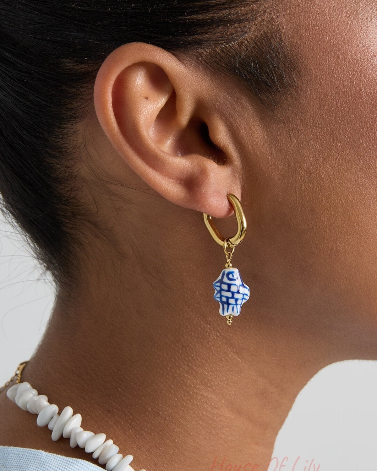 Squoval earrings with checkered fish charm