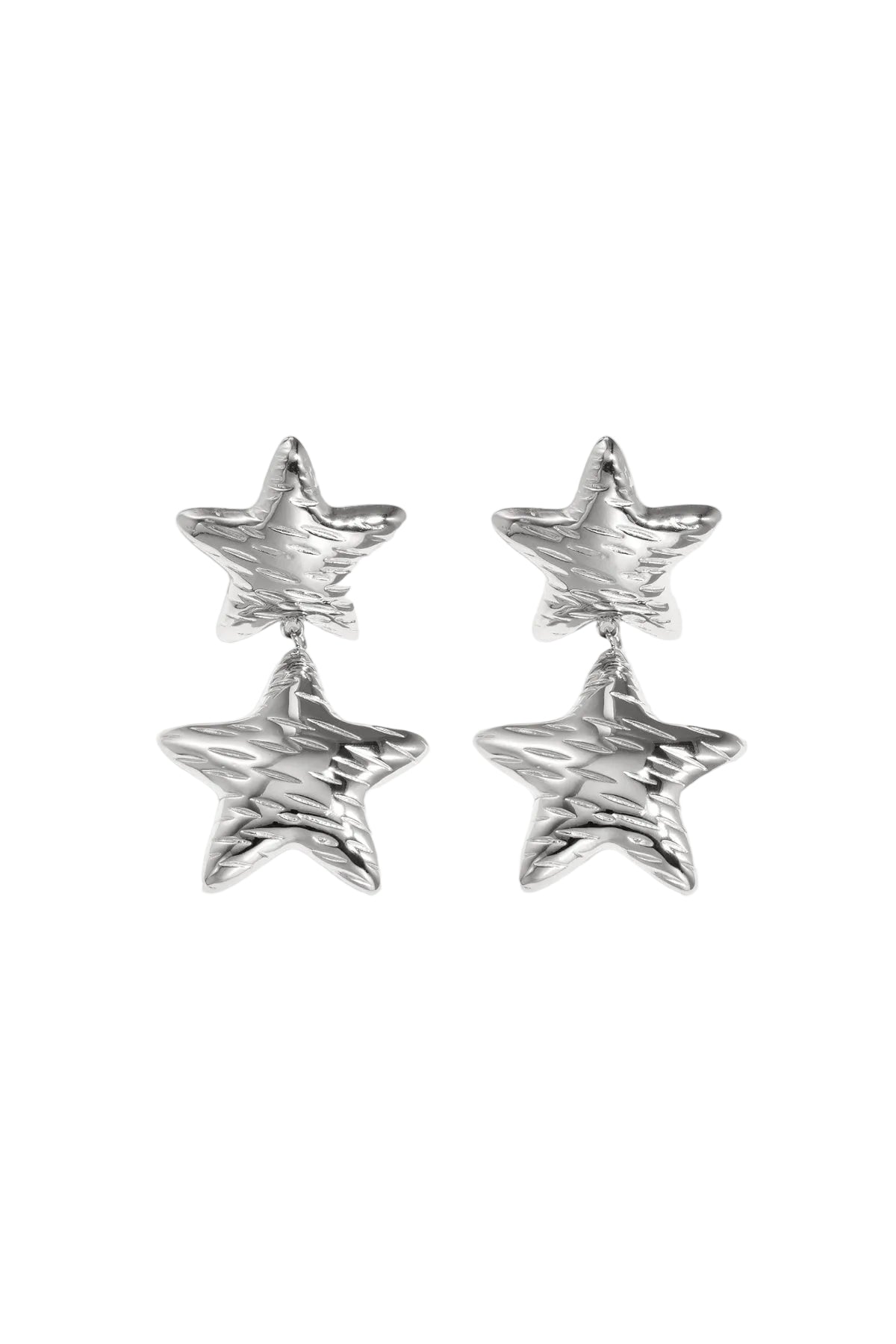 Pair of shiny silver star-shaped double drop earrings with hammered texture on white background