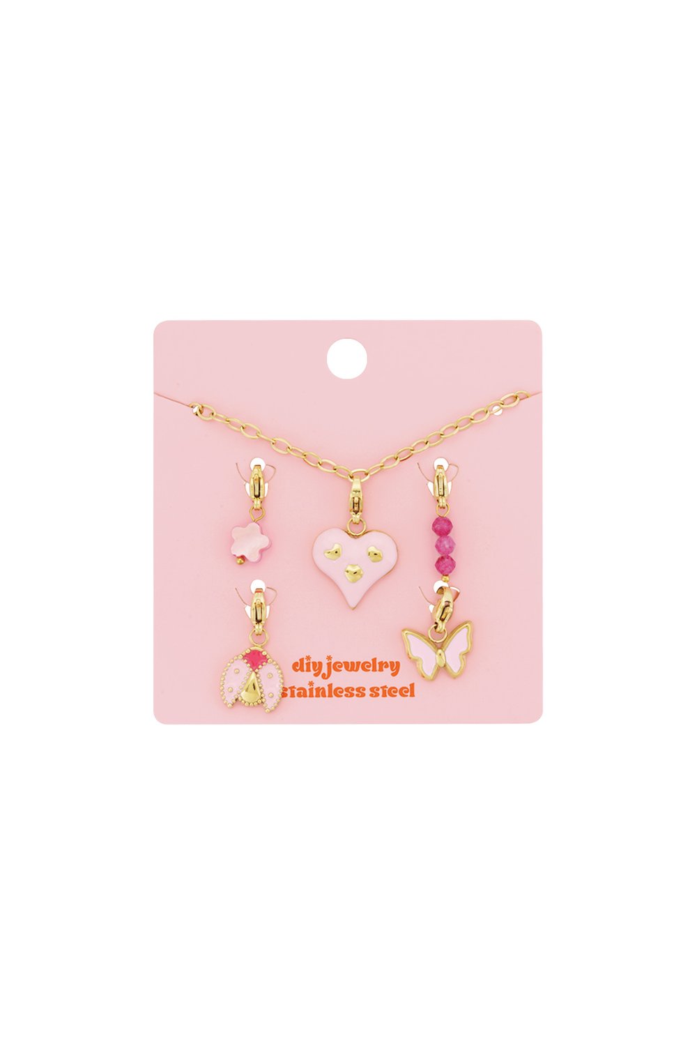 Gold chain charm bracelet set with pink enamel heart, ladybug, butterfly, flower, and beaded charms on a pink card.