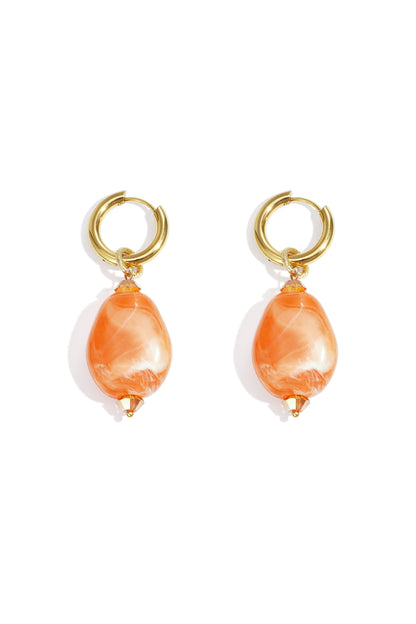 Pair of gold hoop earrings with orange cloudy resin beads