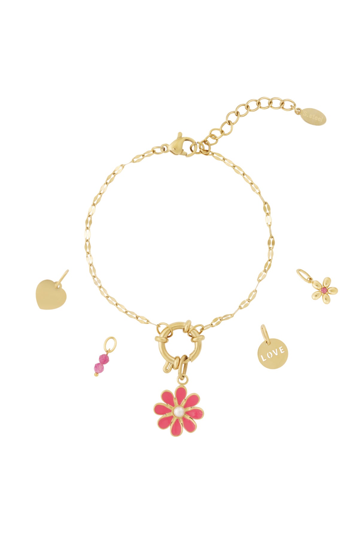 Gold charm bracelet with pink flower enamel charm, heart charm, love disc, and pink beads laid out with loose charms on white background