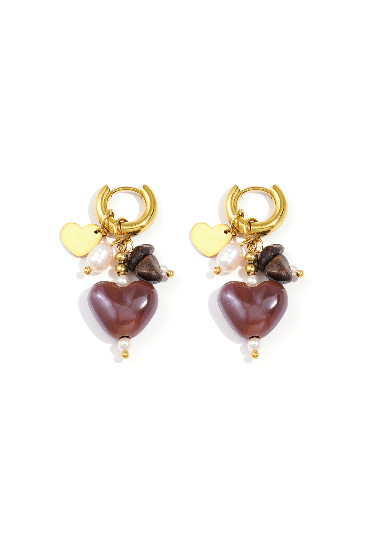 Pair of gold-tone hoop earrings with brown heart charms, natural stones, and faux pearls on white background