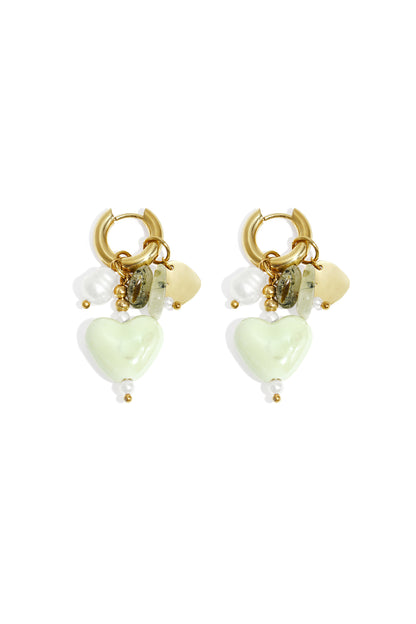 Pair of gold-tone hoop earrings with mint green heart charms, natural stones, and faux pearls on white background