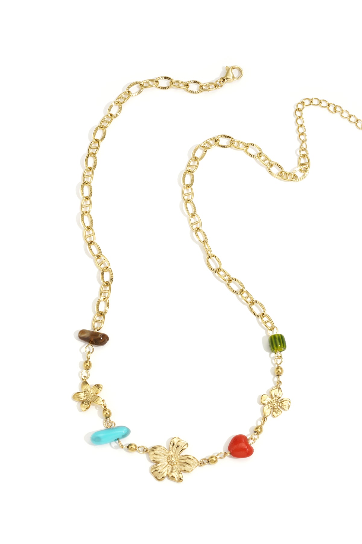 Gold chain necklace with flower charms and colorful beads laid flat on white background