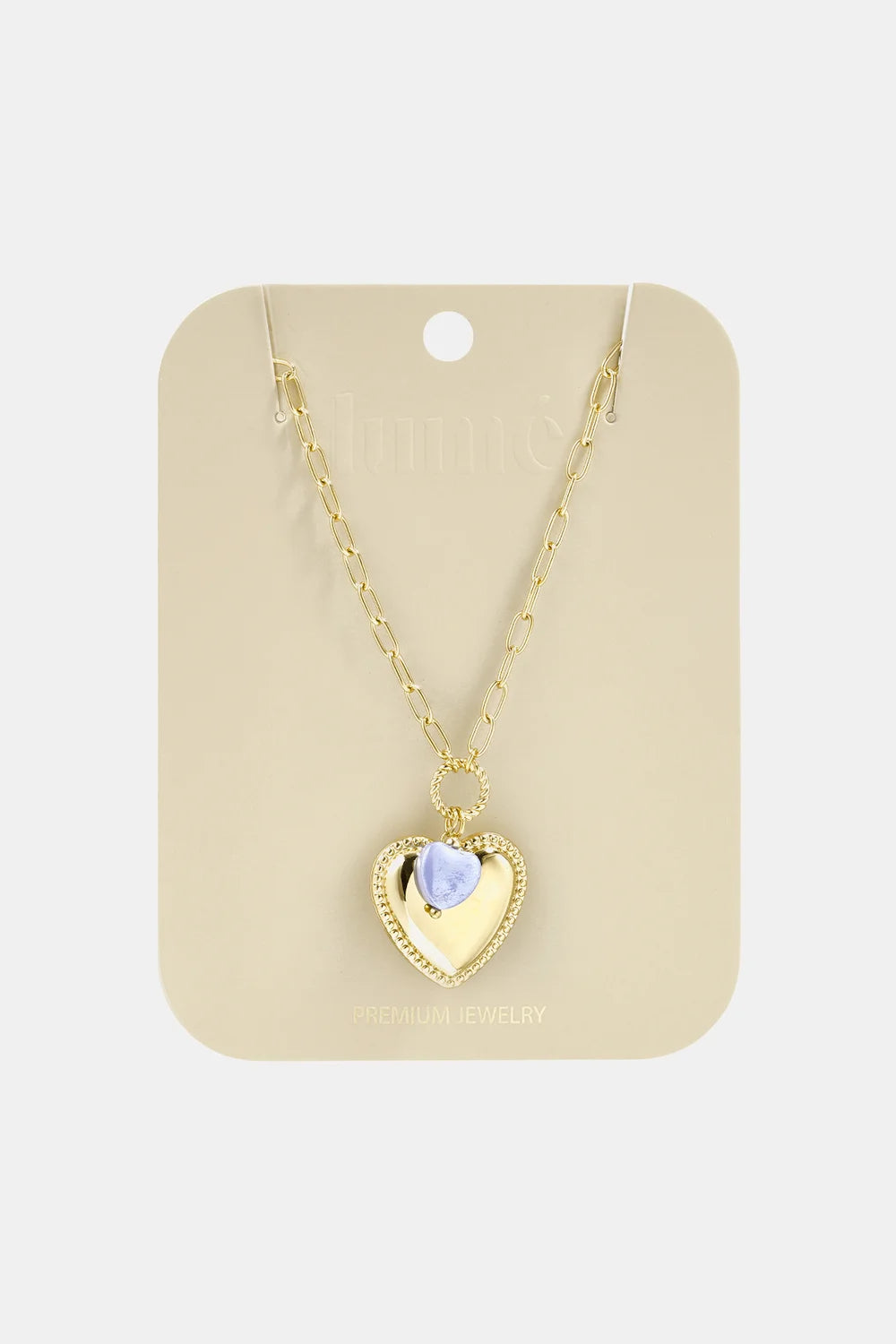 Gold chain necklace featuring a gold heart pendant with a small, light purple heart accent on a display card.