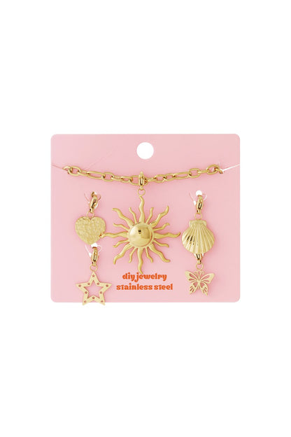 Golden Glow Up: Gold stainless steel jewelry kit featuring a chain and charms shaped like a sun, heart, shell, and star.