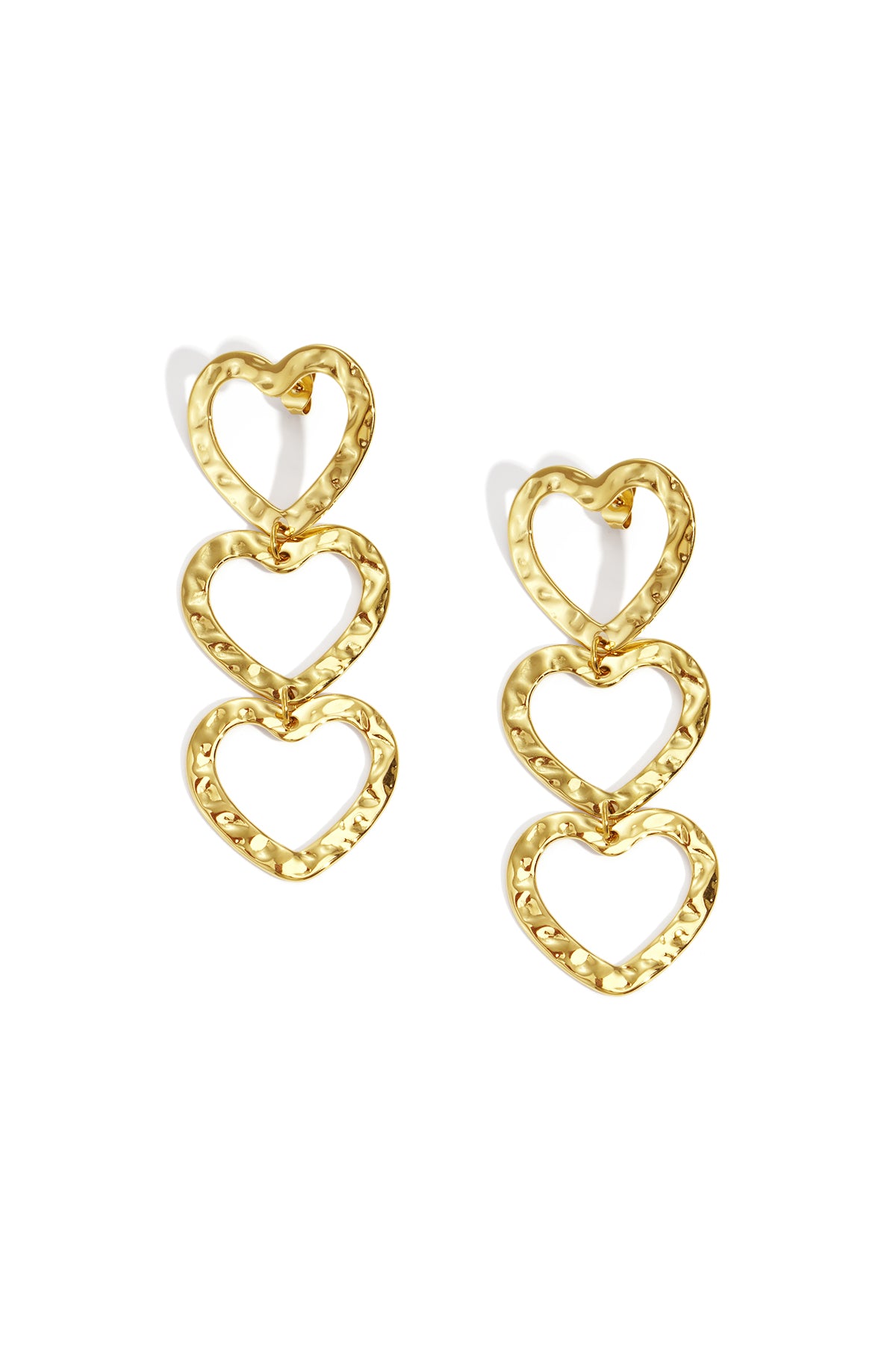 Gold-tone triple heart dangle earrings with hammered texture on white background