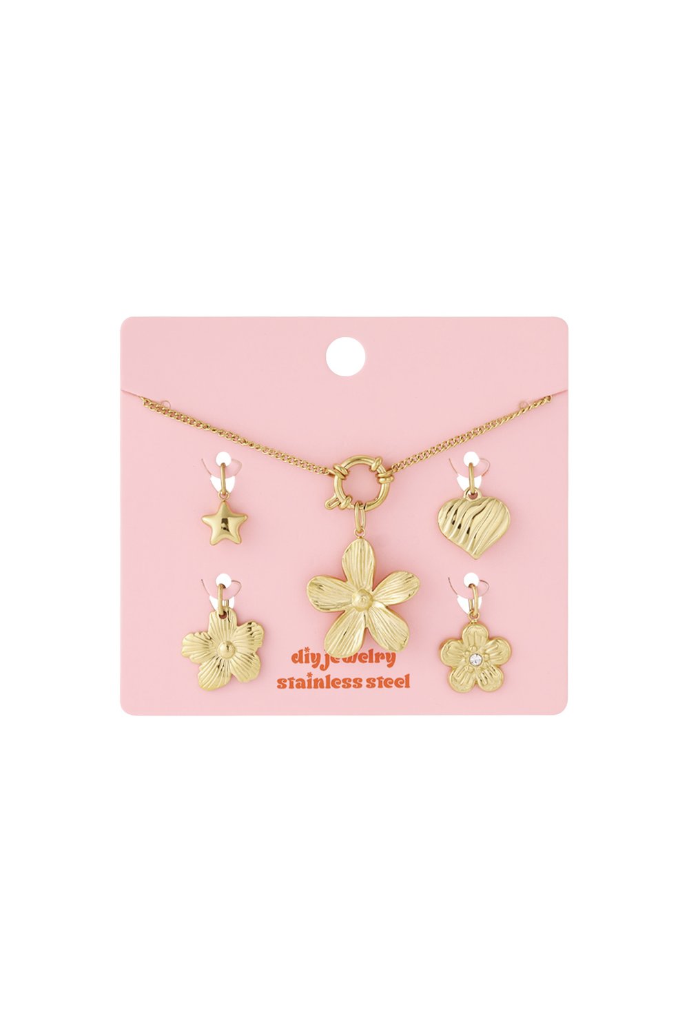 Gold Bloom Core Vibe necklace set featuring a chain and charms shaped like a flower, heart, and star on a pink card.