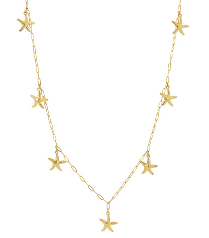Close-up of a gold-tone long necklace featuring multiple starfish charms on a delicate chain against a white background