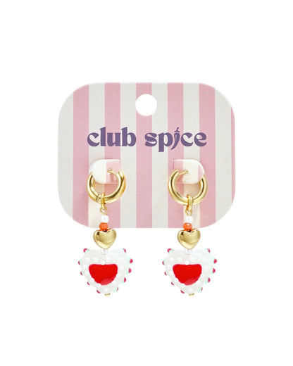 Gold hoop earrings with beaded dangles featuring a small gold heart and a larger white and red heart-shaped bead.