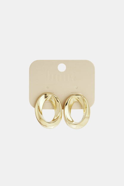 Gold-tone Spiraled Vibe hoop earrings with a thick, twisted oval design on a beige jewelry display card.