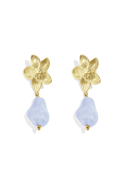 Pair of gold-tone flower drop earrings with bright amber organic acrylic bead on white background