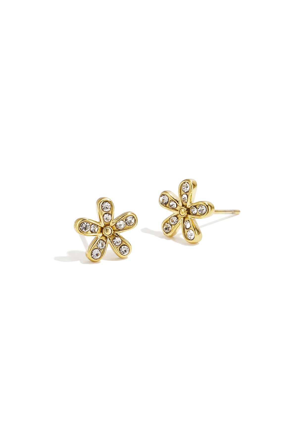 Close-up of sparkling gold flower stud earrings with clear rhinestones on each petal