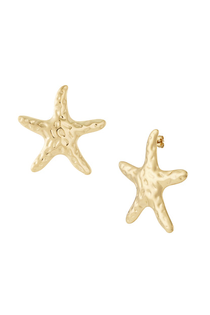 Pair of hammered gold plated starfish stud earrings on white background