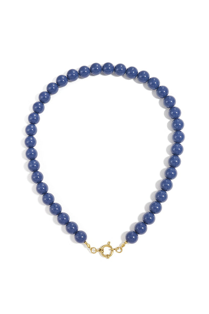 Round blue resin bead necklace with a gold-tone circular clasp, centered on a white background.