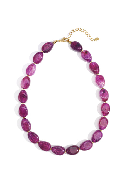 Coffee brown chunky acrylic beaded necklace with gold clasp on white background