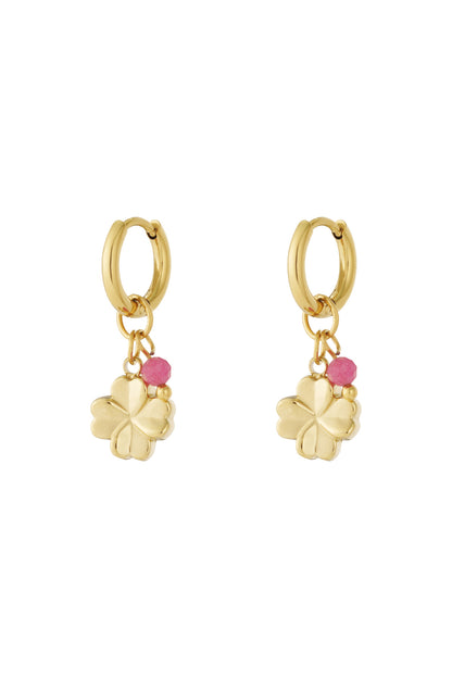 Gold hoop earrings with four-leaf clover charms and pink faceted bead accents shown on white background