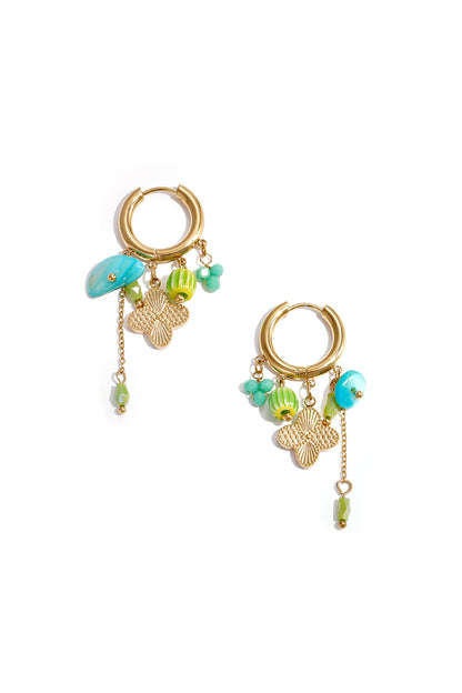 Gold hoop earrings featuring turquoise, green beads, and butterfly charms with chain detail on white background
