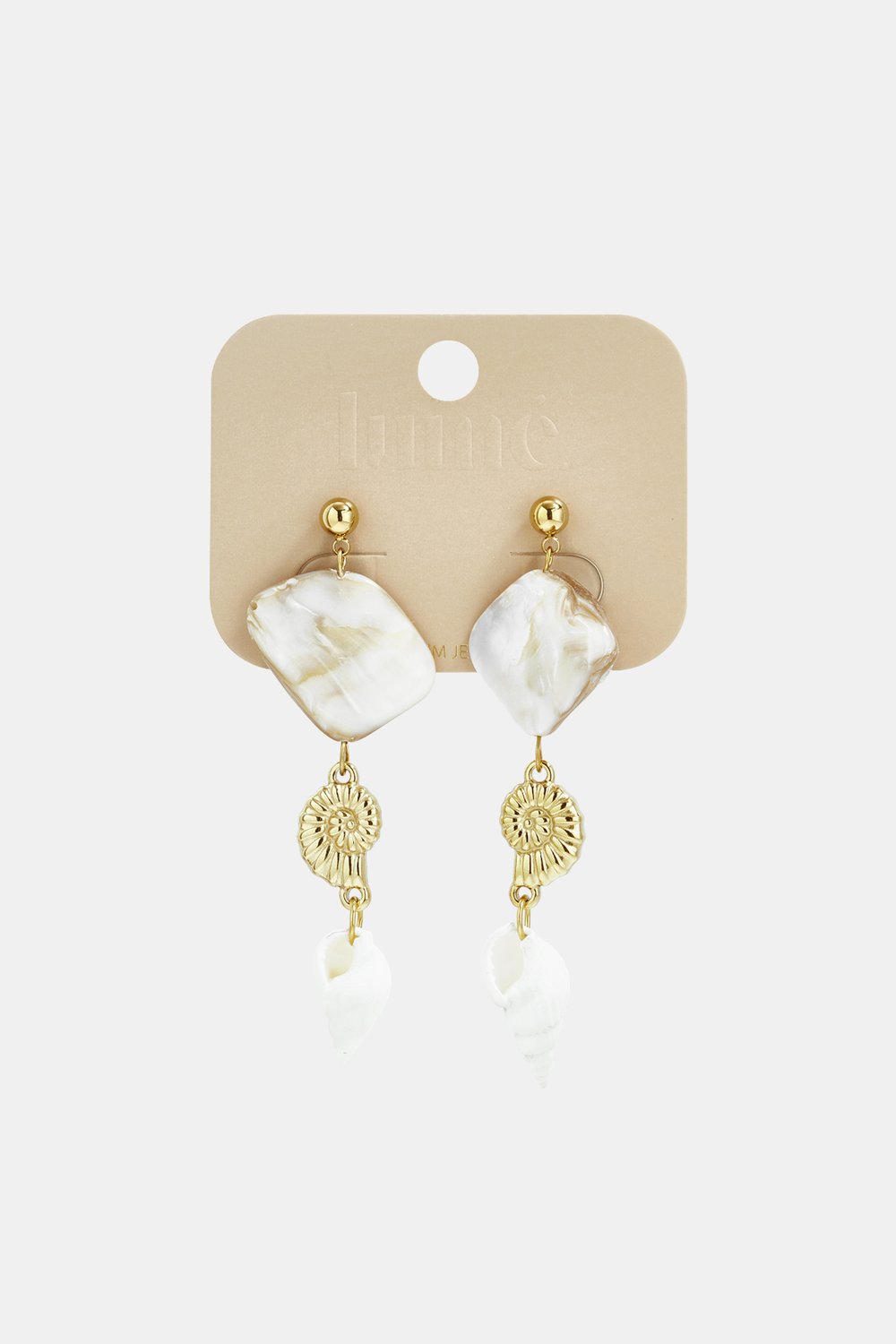 Coastal Dream dangle earrings featuring white marble-look squares, gold metal shell charms, and white spiral seashells.