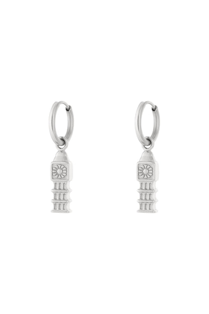 Pair of silver drop hoop earrings with detailed iconic tower charms hanging