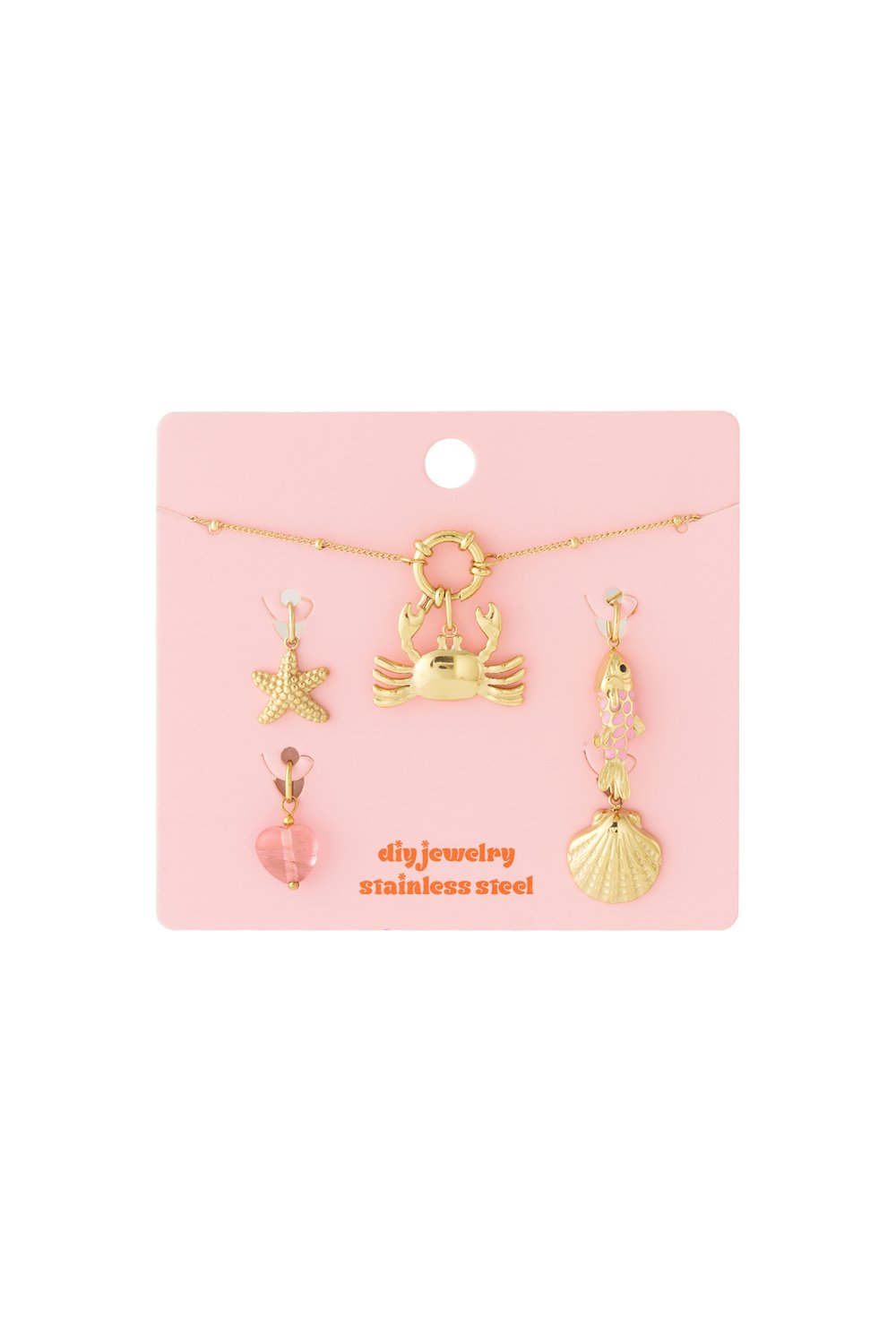 Crab Core Baby: Gold stainless steel jewelry set with crab, starfish, fish, shell, and pink heart charms on pink card.