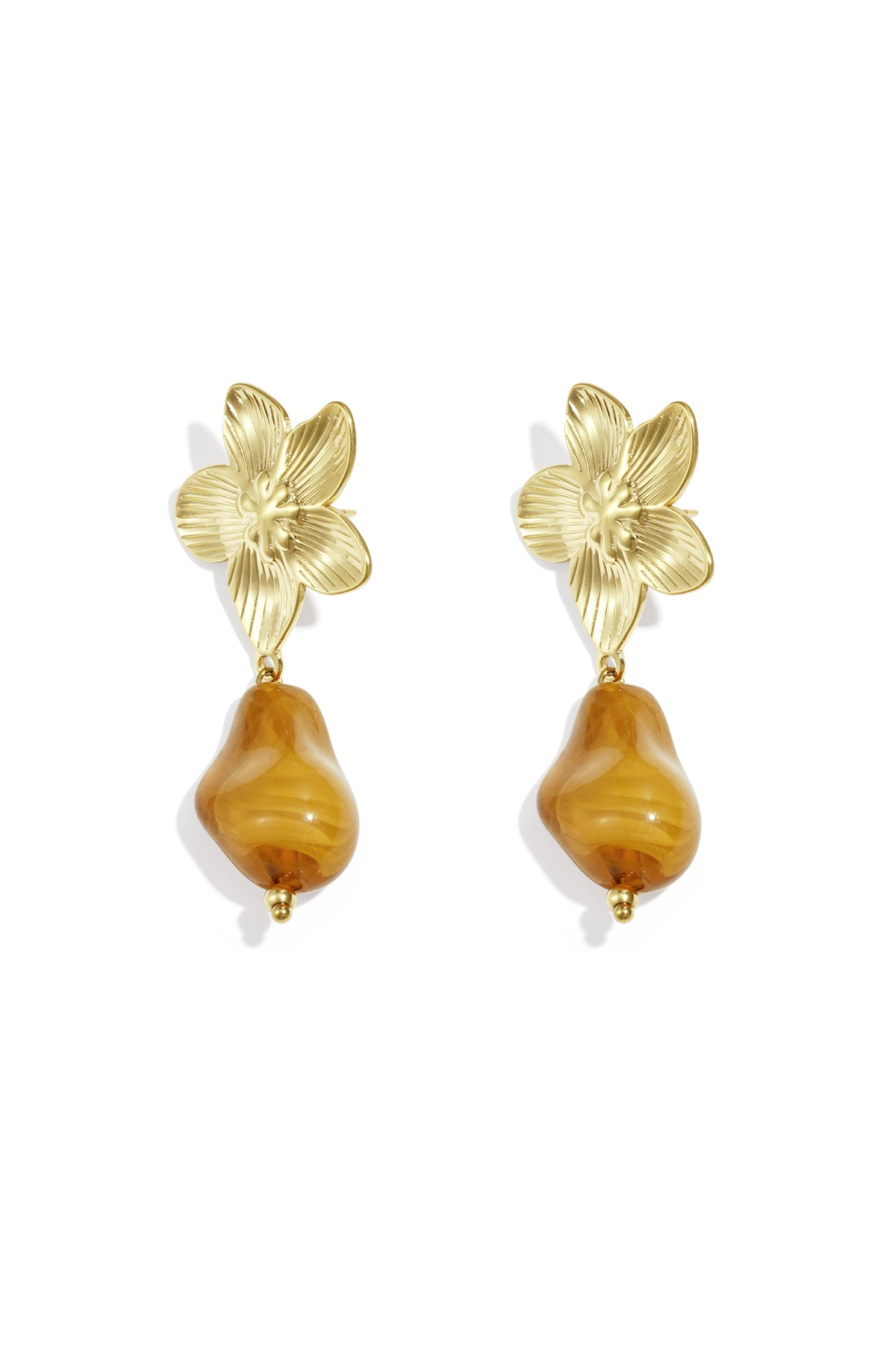 Pair of gold-tone flower drop earrings with amber organic acrylic bead on white background
