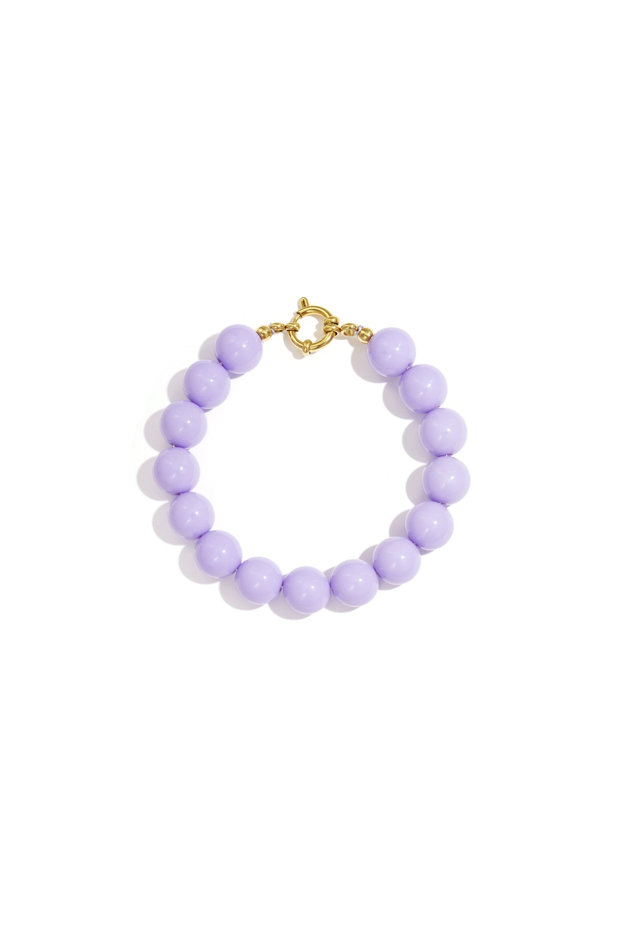 Lavender resin bead bracelet with gold toggle clasp on white background