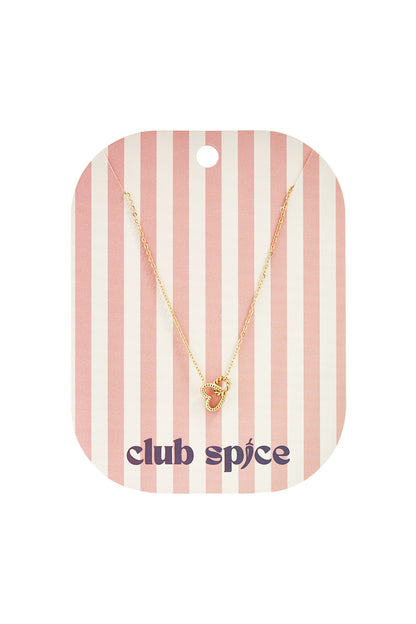 Gold-toned chain necklace featuring an openwork heart-shaped drop pendant, displayed on a striped pink card.